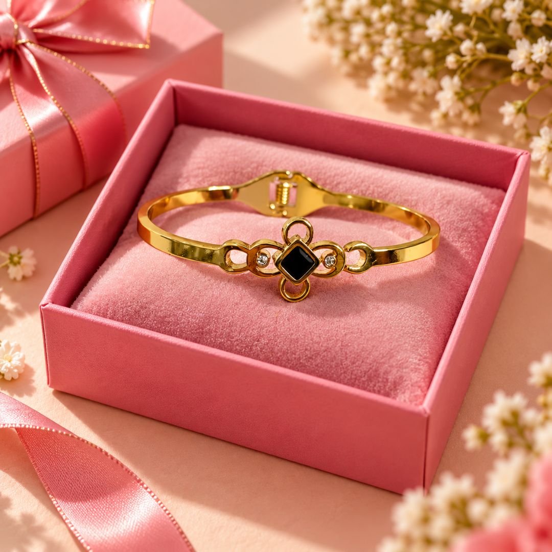 Black stone gold-tone floral bracelet